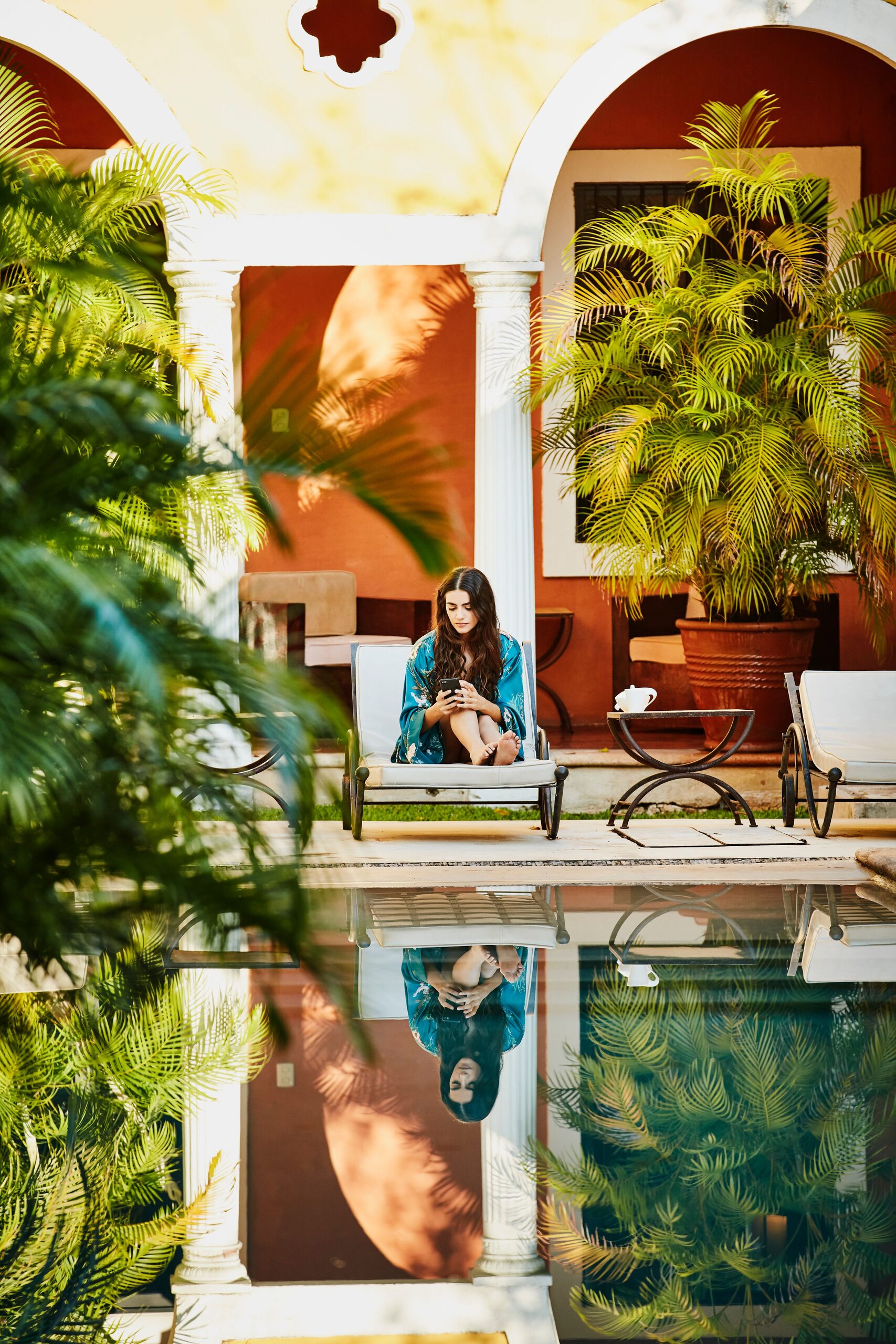 A fashion editorial shoot beside the courtyard pool at Hotel Hacienda Mérida